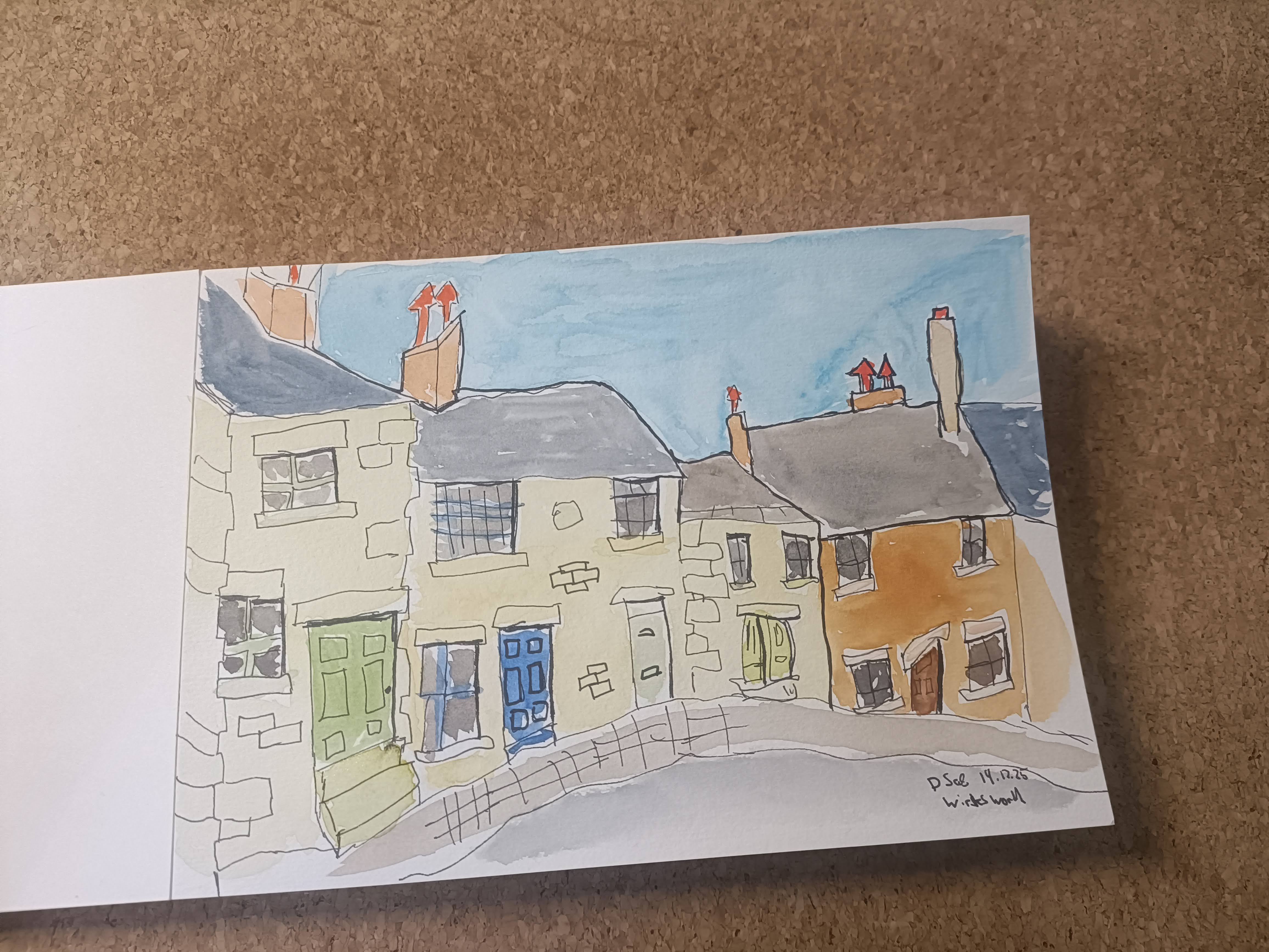 A watercolor sketch of a row of houses with various colored doors, depicting a clear blue sky and chimney tops.